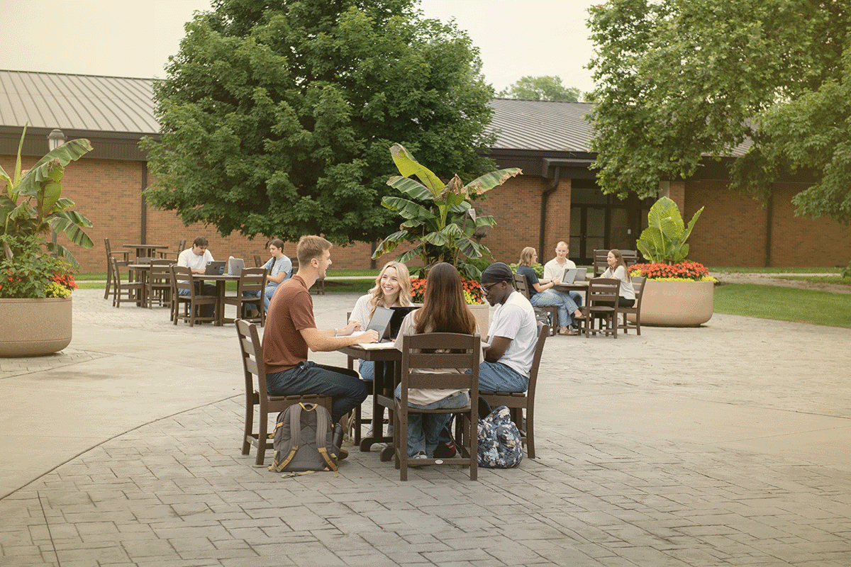 Cedarville students studying together outside on campus